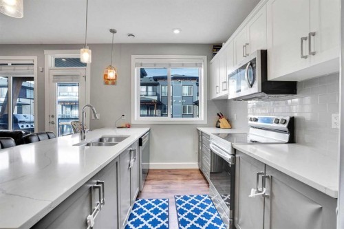 231 Savanna Walk Ne, Calgary, AB - Indoor Photo Showing Kitchen With Double Sink With Upgraded Kitchen