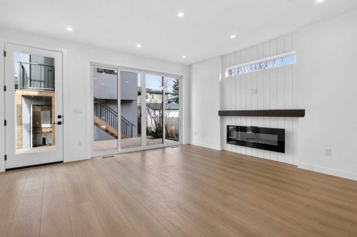 720 52 Avenue Sw, Calgary, AB - Indoor Photo Showing Living Room With Fireplace