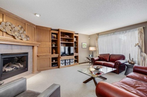 29 Cranleigh Way Se, Calgary, AB - Indoor Photo Showing Living Room With Fireplace