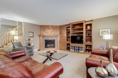 29 Cranleigh Way Se, Calgary, AB - Indoor Photo Showing Living Room With Fireplace