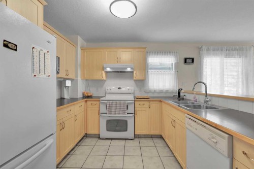 730 69 Avenue Sw, Calgary, AB - Indoor Photo Showing Kitchen With Double Sink