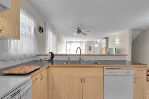 730 69 Avenue Sw, Calgary, AB - Indoor Photo Showing Kitchen With Double Sink