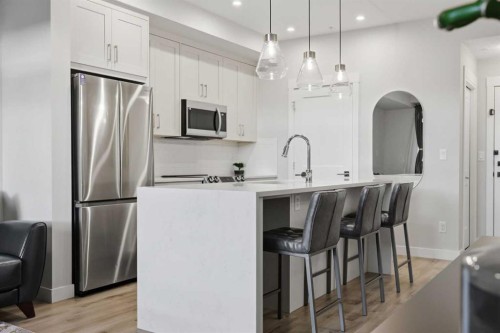 4210-200 Seton Circle Se, Calgary, AB - Indoor Photo Showing Kitchen With Stainless Steel Kitchen With Upgraded Kitchen