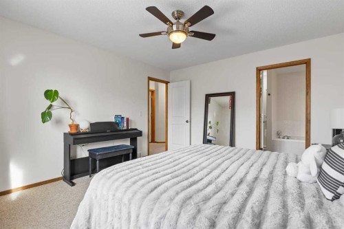 921 Cranston Drive Se, Calgary, AB - Indoor Photo Showing Bedroom