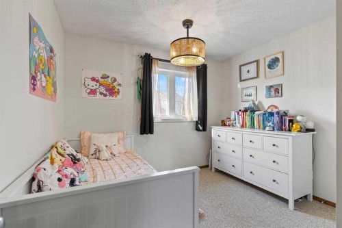 921 Cranston Drive Se, Calgary, AB - Indoor Photo Showing Bedroom