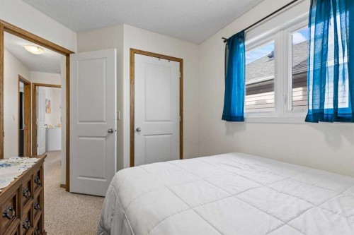 921 Cranston Drive Se, Calgary, AB - Indoor Photo Showing Bedroom