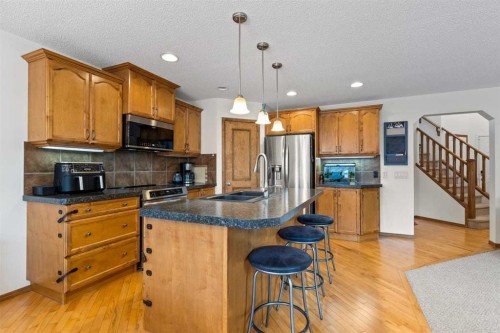 921 Cranston Drive Se, Calgary, AB - Indoor Photo Showing Kitchen With Stainless Steel Kitchen With Double Sink