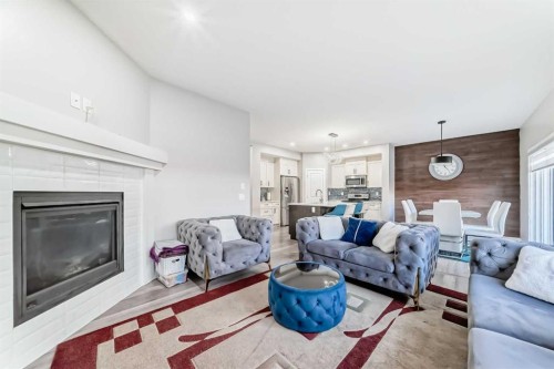 199 Kinniburgh Road, Chestermere, AB - Indoor Photo Showing Living Room With Fireplace