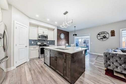 199 Kinniburgh Road, Chestermere, AB - Indoor Photo Showing Kitchen With Stainless Steel Kitchen With Double Sink With Upgraded Kitchen