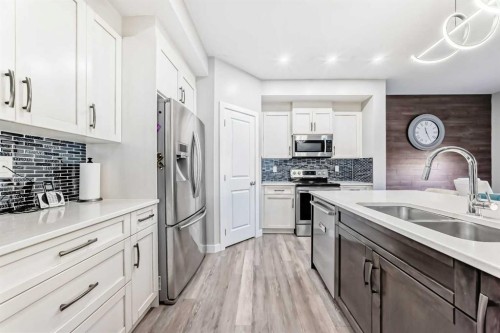 199 Kinniburgh Road, Chestermere, AB - Indoor Photo Showing Kitchen With Stainless Steel Kitchen With Double Sink With Upgraded Kitchen