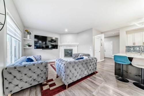 199 Kinniburgh Road, Chestermere, AB - Indoor Photo Showing Other Room With Fireplace