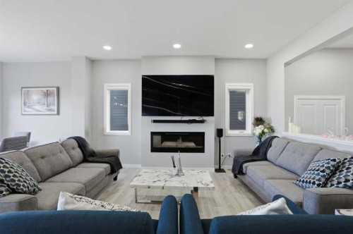276 Calhoun Crescent Ne, Calgary, AB - Indoor Photo Showing Living Room With Fireplace
