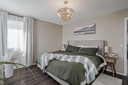 67 Silver Springs Way Nw, Airdrie, AB - Indoor Photo Showing Bedroom
