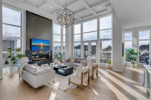 100 Elkton Close Sw, Calgary, AB - Indoor Photo Showing Living Room With Fireplace