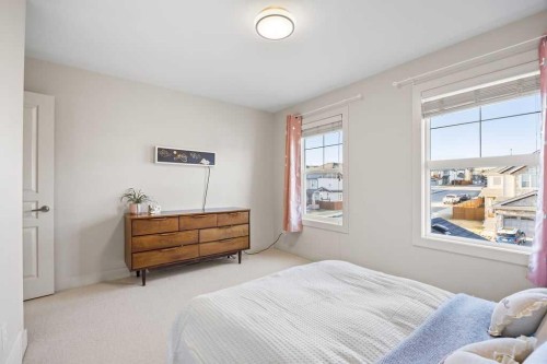 59 Cortina Way Sw, Calgary, AB - Indoor Photo Showing Bedroom