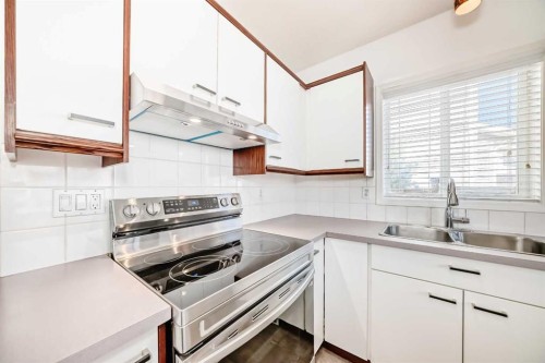 55 Shawbrooke Crescent Sw, Calgary, AB - Indoor Photo Showing Kitchen With Double Sink