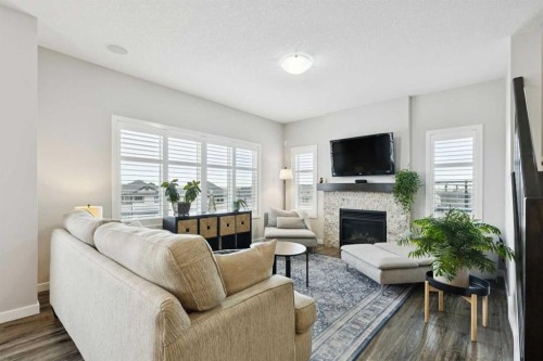 331 Hillcrest Heights Sw, Airdrie, AB - Indoor Photo Showing Living Room With Fireplace