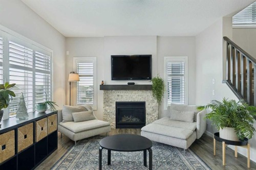 331 Hillcrest Heights Sw, Airdrie, AB - Indoor Photo Showing Living Room With Fireplace
