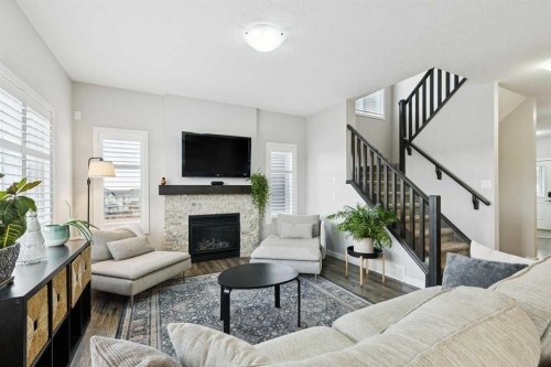 331 Hillcrest Heights Sw, Airdrie, AB - Indoor Photo Showing Living Room With Fireplace