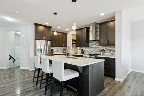 331 Hillcrest Heights Sw, Airdrie, AB - Indoor Photo Showing Kitchen With Upgraded Kitchen