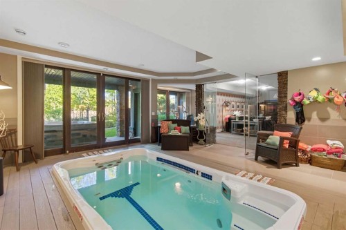 41 Evergreen Mount Sw, Calgary, AB - Indoor Photo Showing Other Room With In Ground Pool