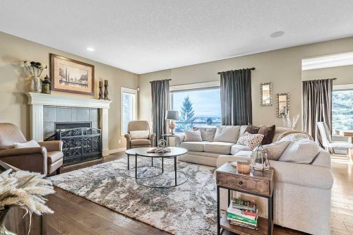 208 Tuscany Ravine View Nw, Calgary, AB - Indoor Photo Showing Living Room With Fireplace