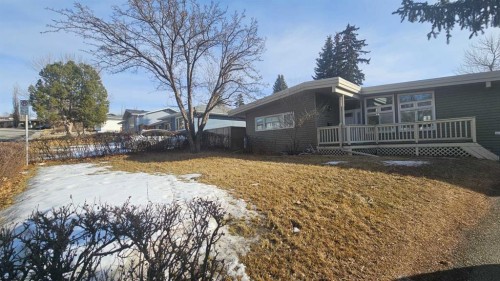 4 Clarendon Road Nw, Calgary, AB - Outdoor With Deck Patio Veranda