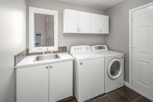 79 Hamptons Heights Nw, Calgary, AB - Indoor Photo Showing Laundry Room