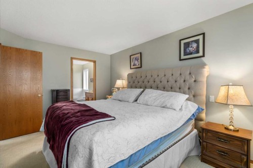 310 Riverside Garden Nw, High River, AB - Indoor Photo Showing Bedroom