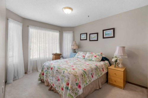 310 Riverside Garden Nw, High River, AB - Indoor Photo Showing Bedroom