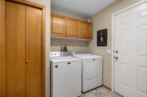 310 Riverside Garden Nw, High River, AB - Indoor Photo Showing Laundry Room