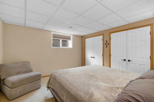 310 Riverside Garden Nw, High River, AB - Indoor Photo Showing Bedroom