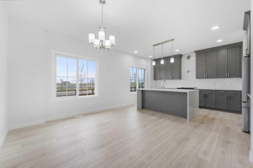 142 Sunstone Way, Balzac, AB - Indoor Photo Showing Kitchen With Upgraded Kitchen