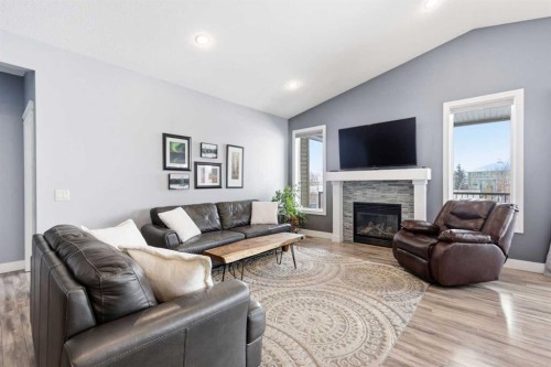 2026 High Country Rise Nw, High River, AB - Indoor Photo Showing Living Room With Fireplace