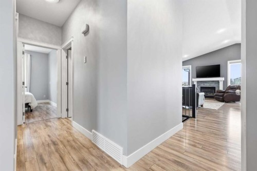 2026 High Country Rise Nw, High River, AB - Indoor Photo Showing Other Room With Fireplace