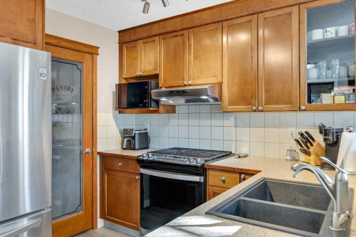 71 Eversyde Heath Sw, Calgary, AB - Indoor Photo Showing Kitchen With Double Sink