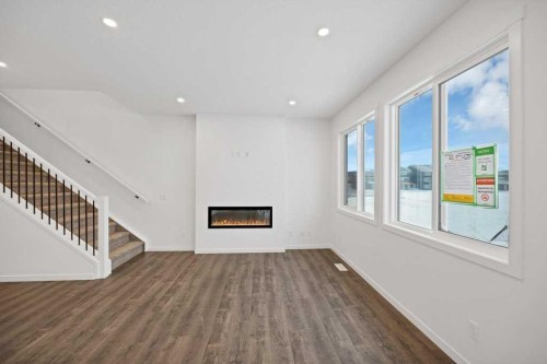 569 Chelsea Gardens, Chestermere, AB - Indoor Photo Showing Other Room With Fireplace