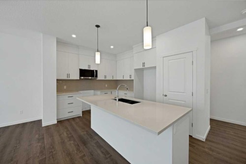 569 Chelsea Gardens, Chestermere, AB - Indoor Photo Showing Kitchen With Double Sink