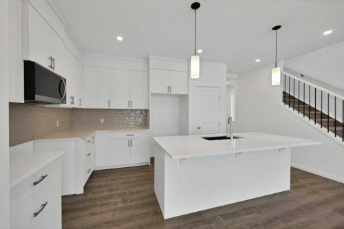 569 Chelsea Gardens, Chestermere, AB - Indoor Photo Showing Kitchen With Upgraded Kitchen