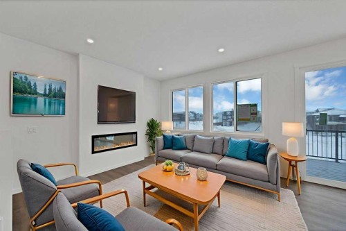 569 Chelsea Gardens, Chestermere, AB - Indoor Photo Showing Living Room With Fireplace