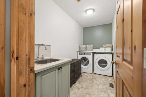 122 Hidden Creek Heights Nw, Calgary, AB - Indoor Photo Showing Laundry Room