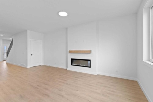 175 Belvedere Crescent Se, Calgary, AB - Indoor Photo Showing Other Room With Fireplace