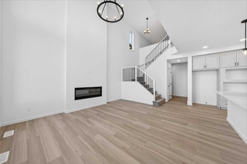 82 Versant Rise Sw, Calgary, AB - Indoor With Fireplace
