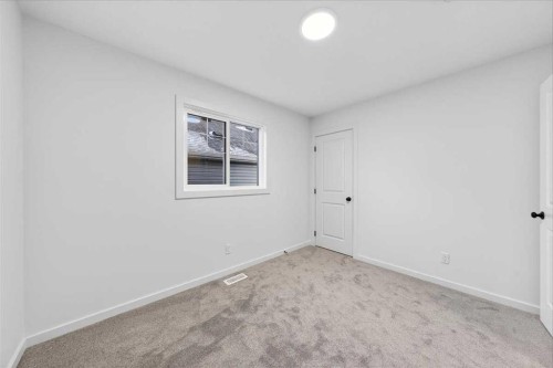 82 Versant Rise Sw, Calgary, AB - Indoor Photo Showing Other Room