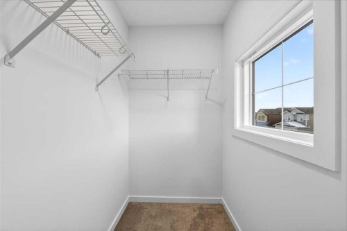 82 Versant Rise Sw, Calgary, AB - Indoor Photo Showing Other Room