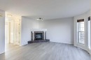 13 Coville Gardens Ne, Calgary, AB  - Indoor Photo Showing Living Room With Fireplace 