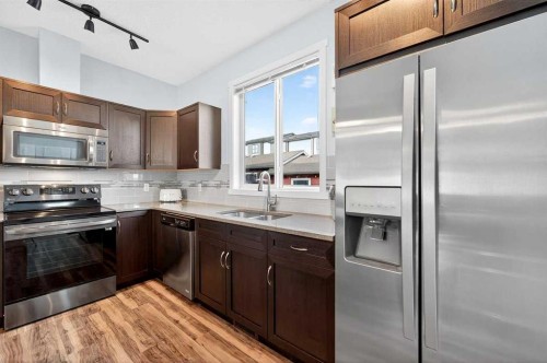 82 Mahogany Drive Se, Calgary, AB - Indoor Photo Showing Kitchen With Stainless Steel Kitchen With Double Sink