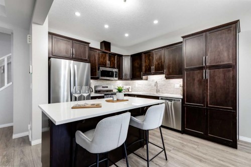 22 Osborne Common Sw, Airdrie, AB - Indoor Photo Showing Kitchen With Stainless Steel Kitchen With Upgraded Kitchen