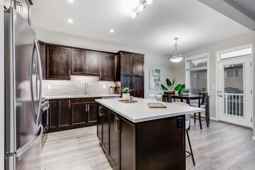 22 Osborne Common Sw, Airdrie, AB - Indoor Photo Showing Kitchen With Stainless Steel Kitchen With Upgraded Kitchen