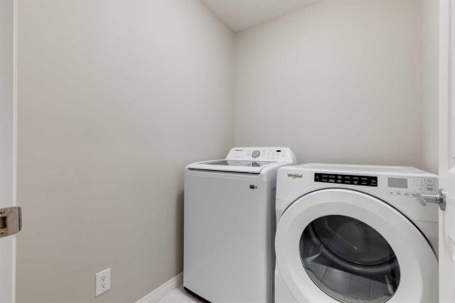 22 Osborne Common Sw, Airdrie, AB - Indoor Photo Showing Laundry Room